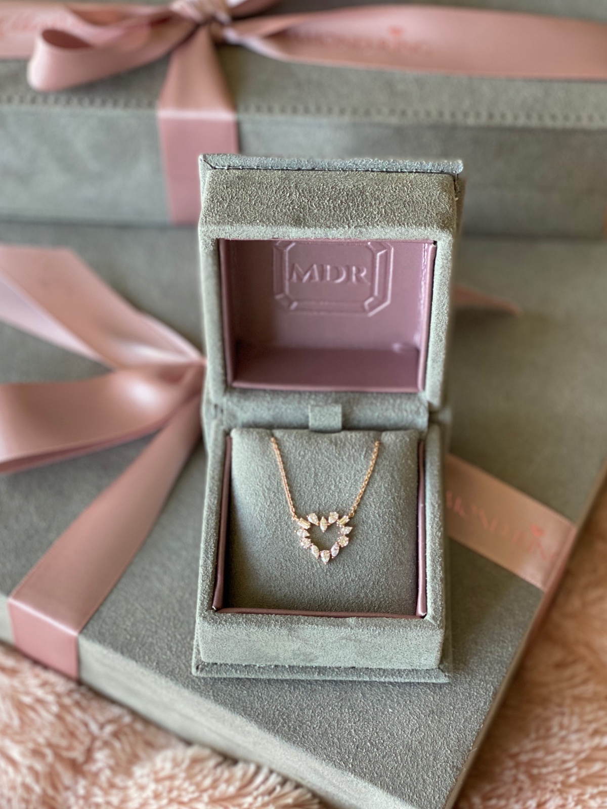 Heart pendant necklace in velvet gift box closeup