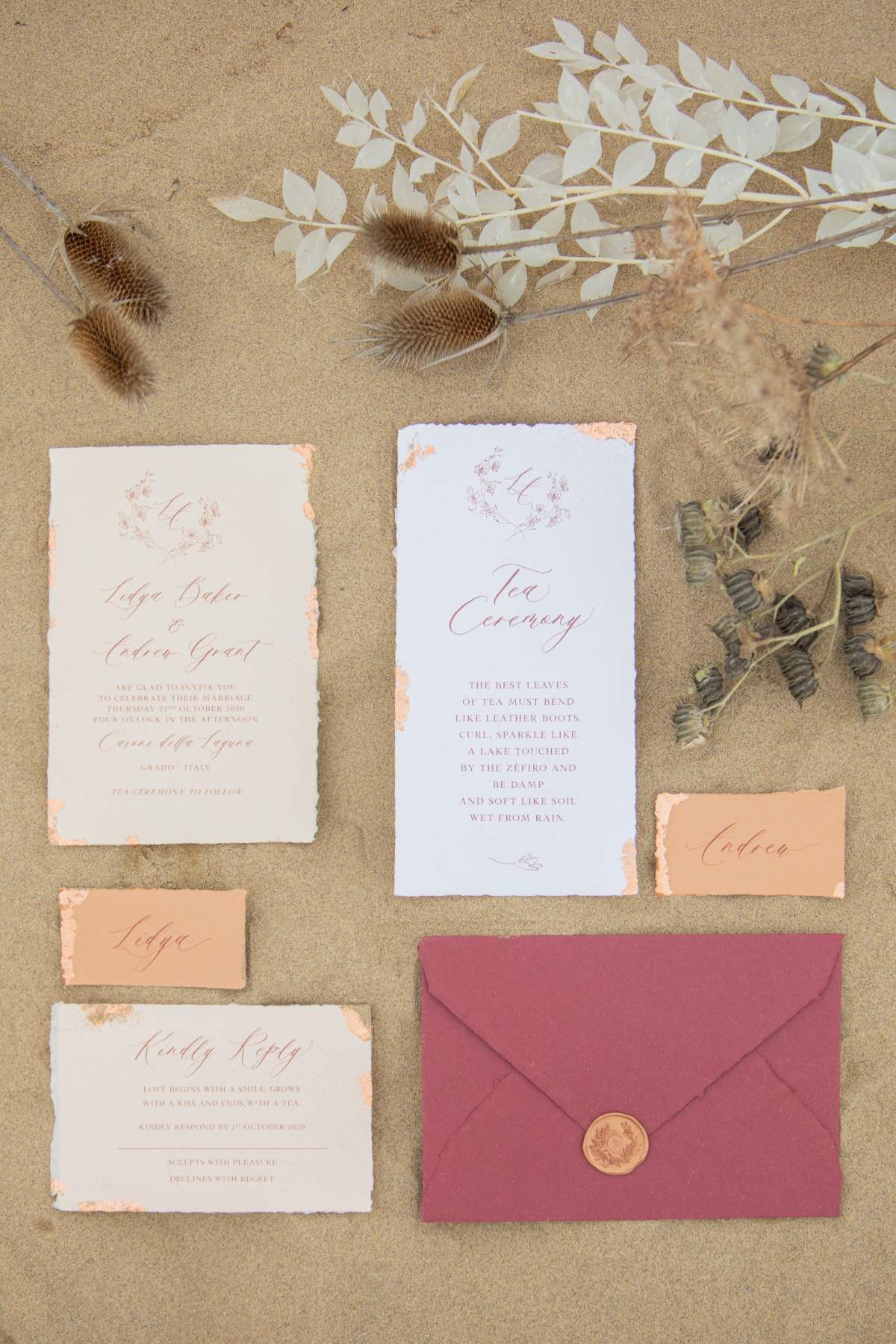 Elegant wedding invitation suite with dried floral accents