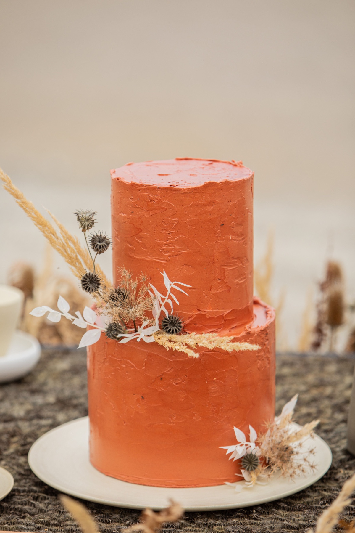 Two tiered orange cake with floral decoration