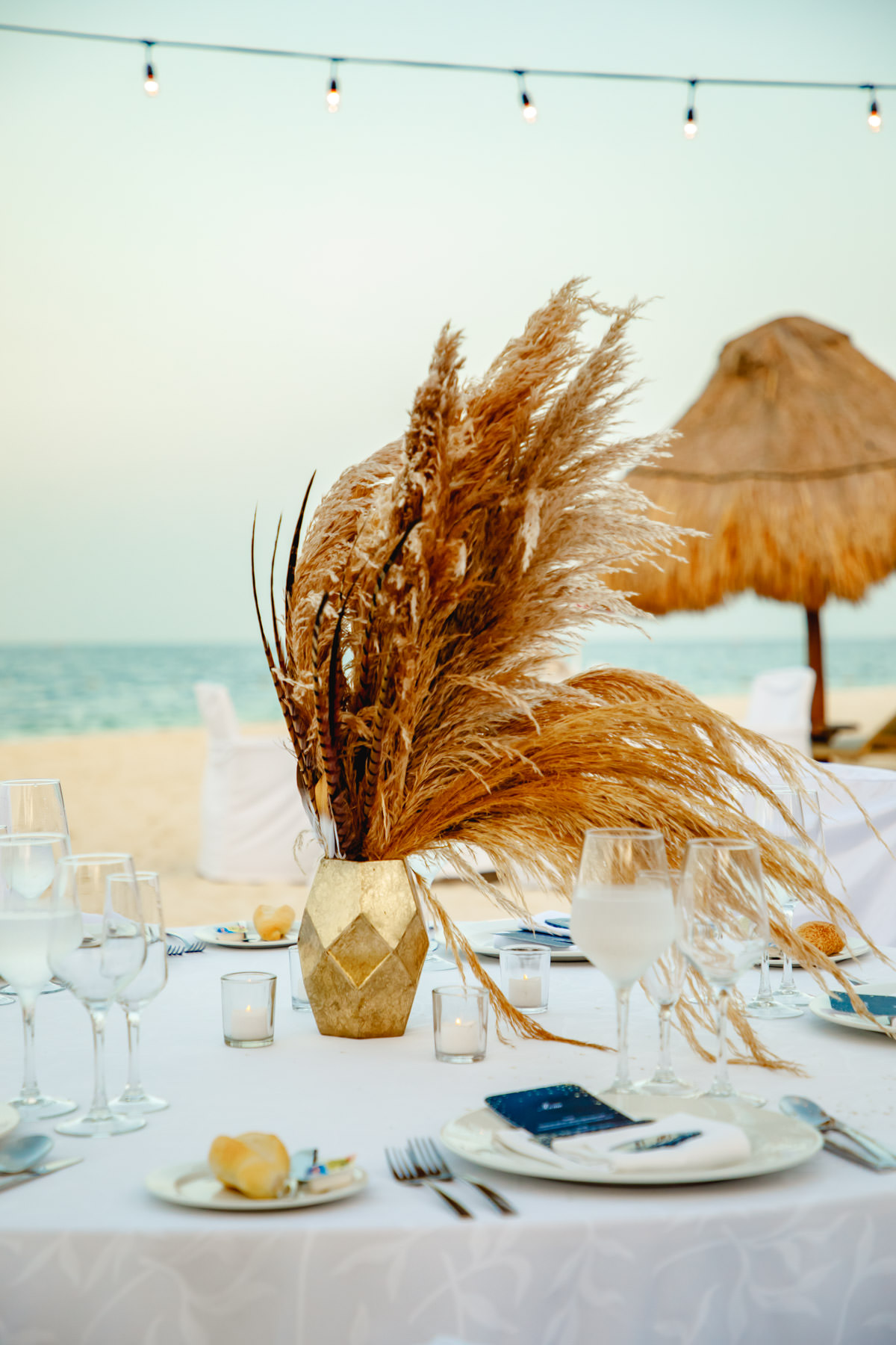 Beach wedding table setting with pampas grass