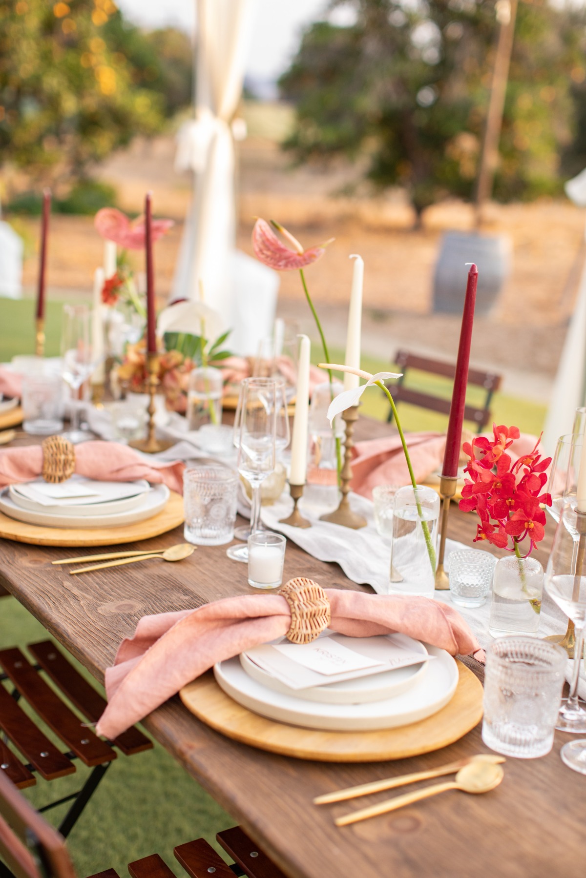 Elegant outdoor wedding table setting with floral decor