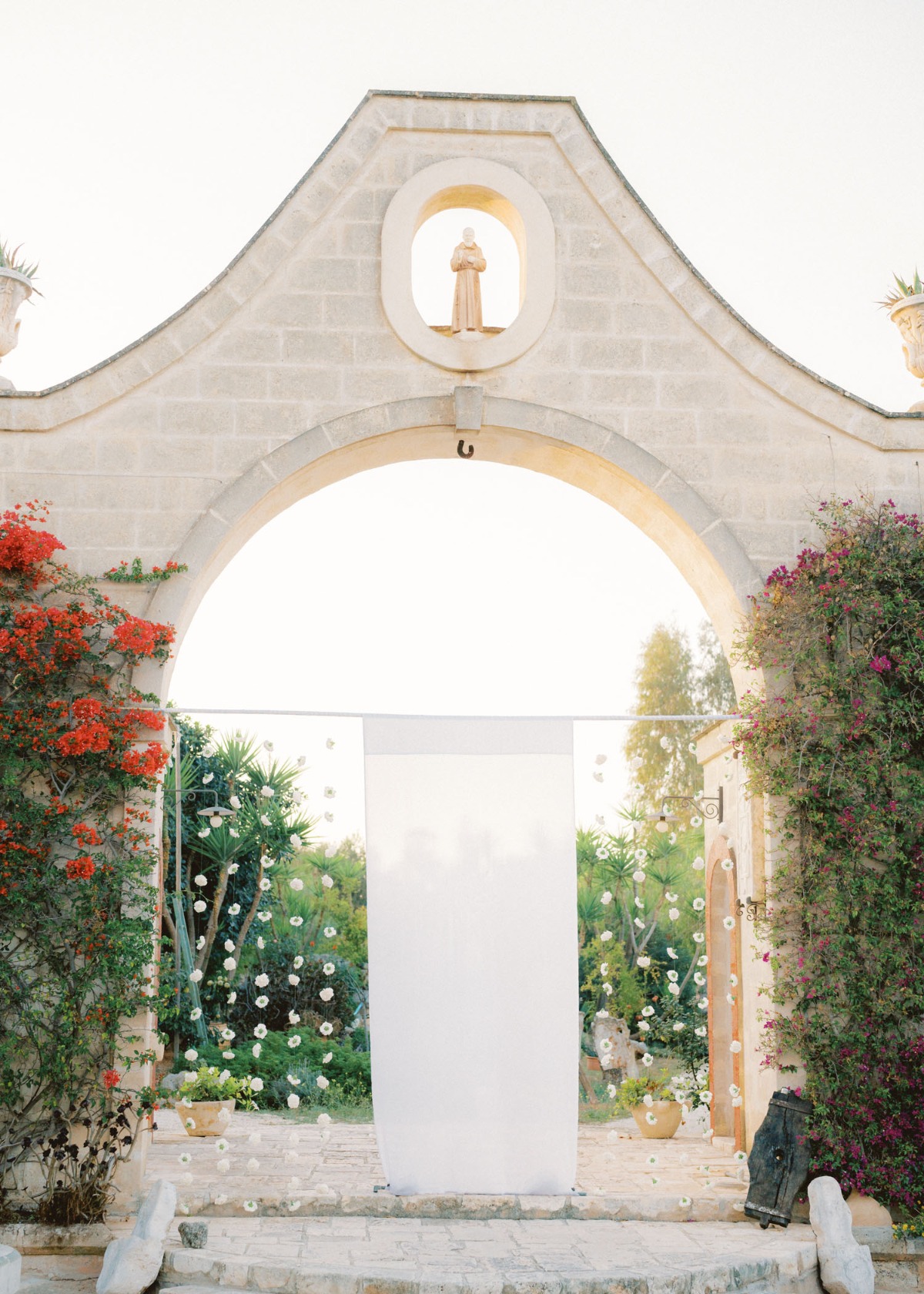 Endless ruffles and Apulian charm in this Italian celebration in purest white