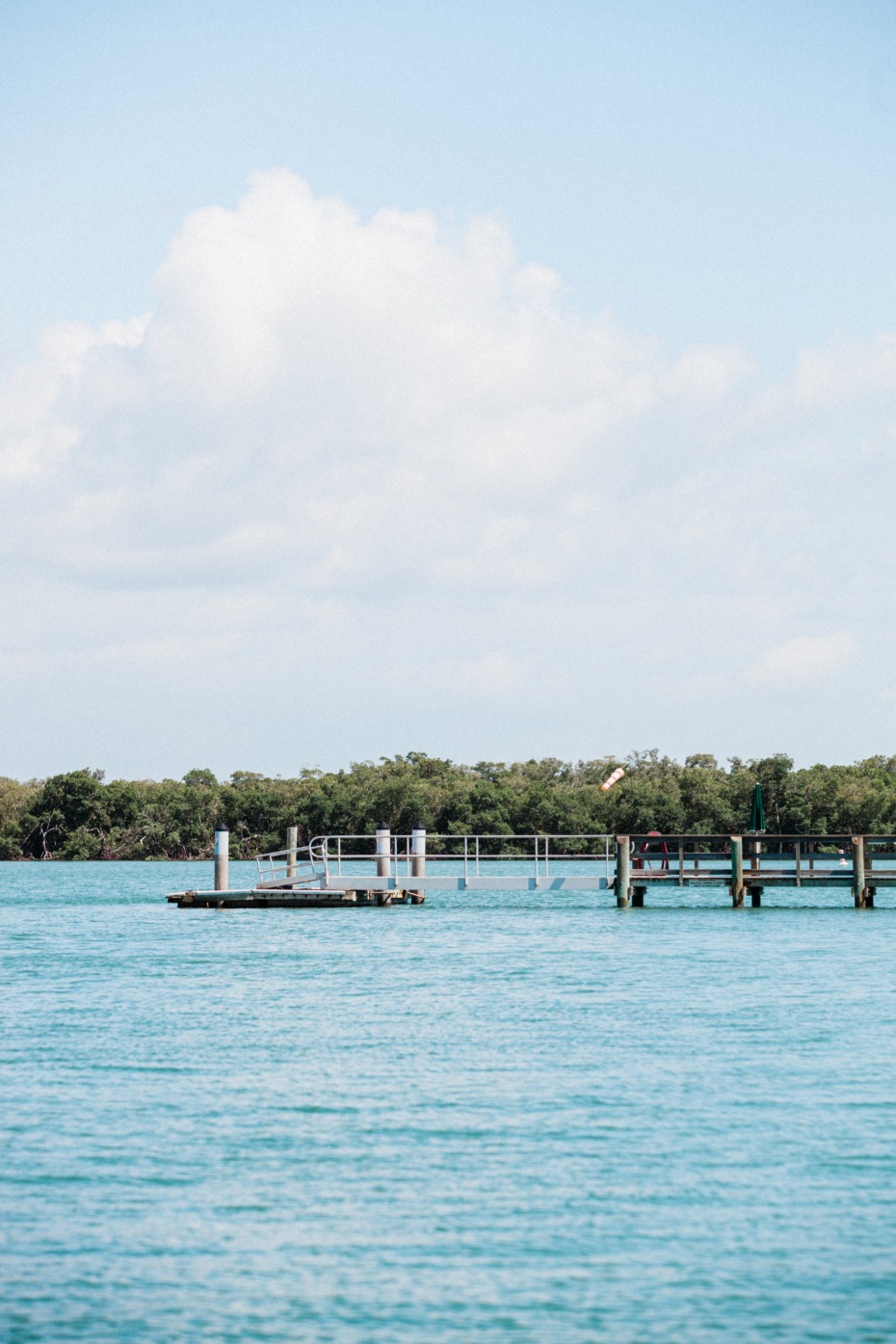 Peaceful docks and blue waters under a bright sunny sky
