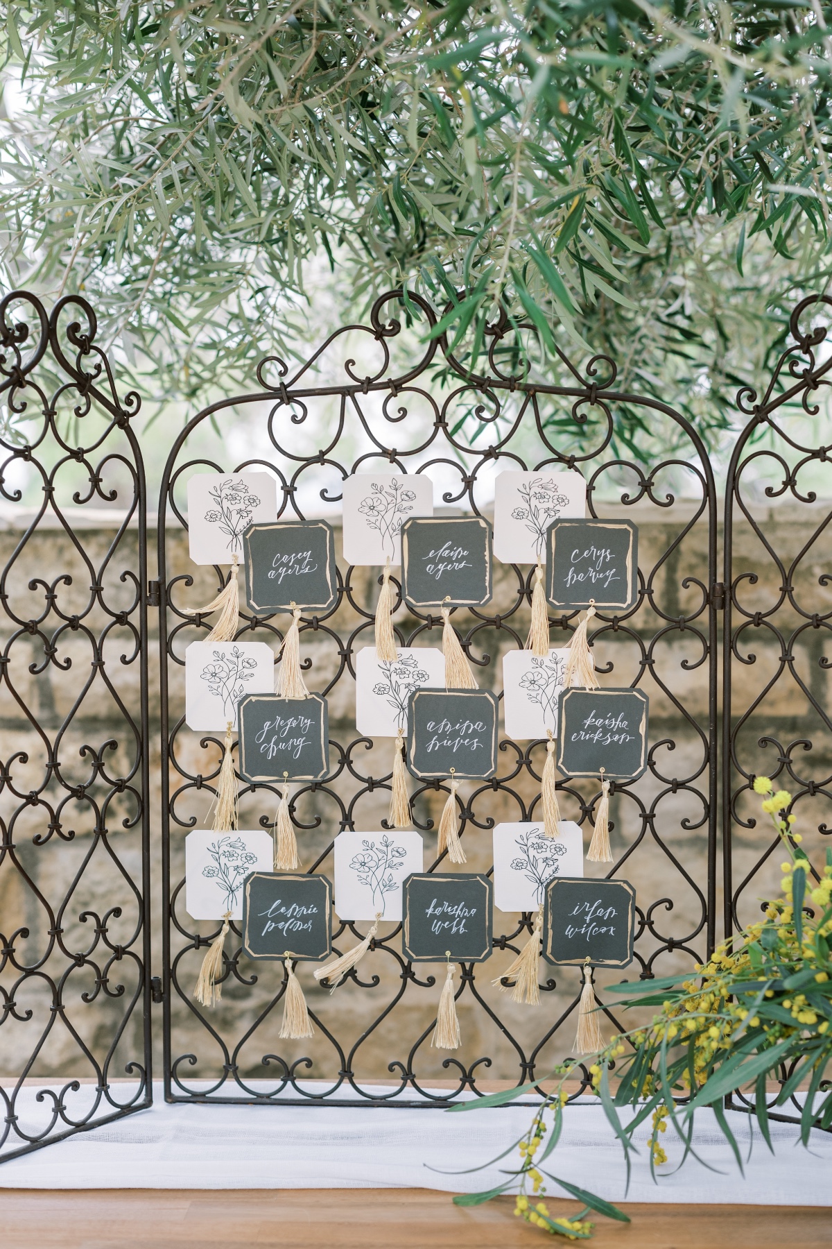 Elegant wedding seating chart with calligraphy place cards