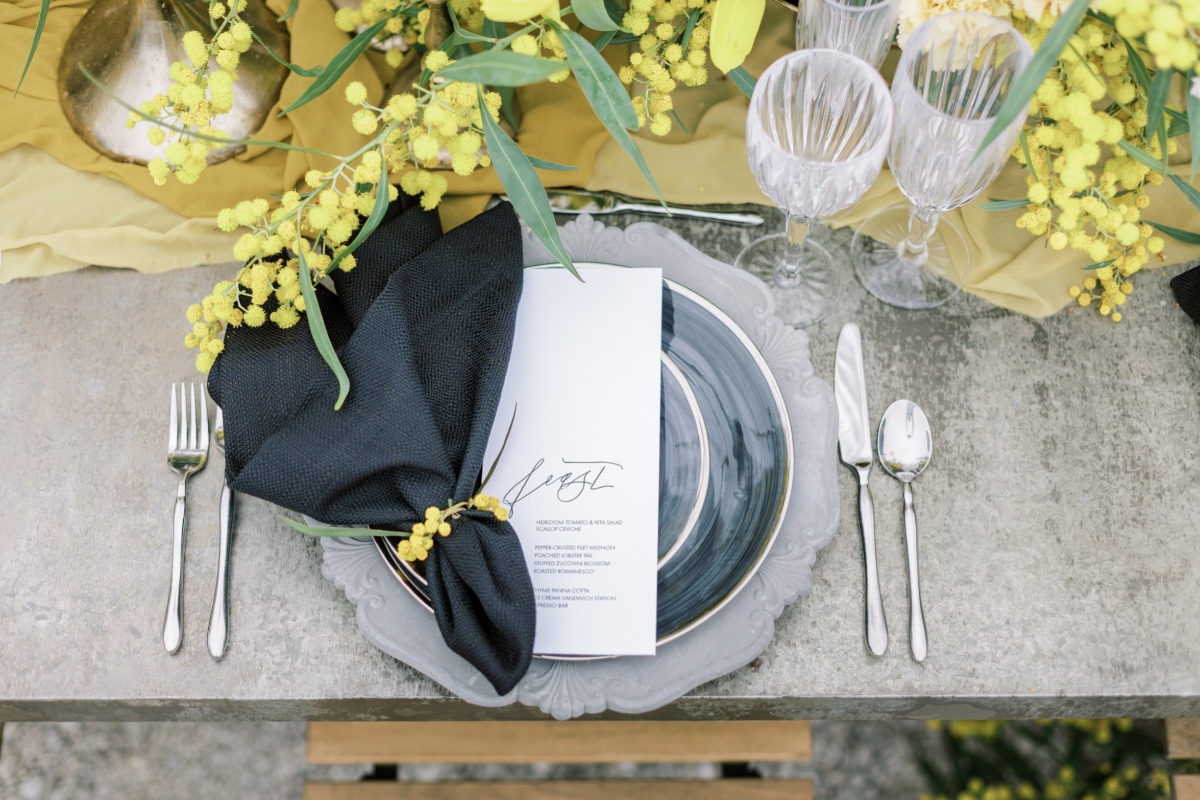 Elegant tablescape with mimosa flowers and gray plate