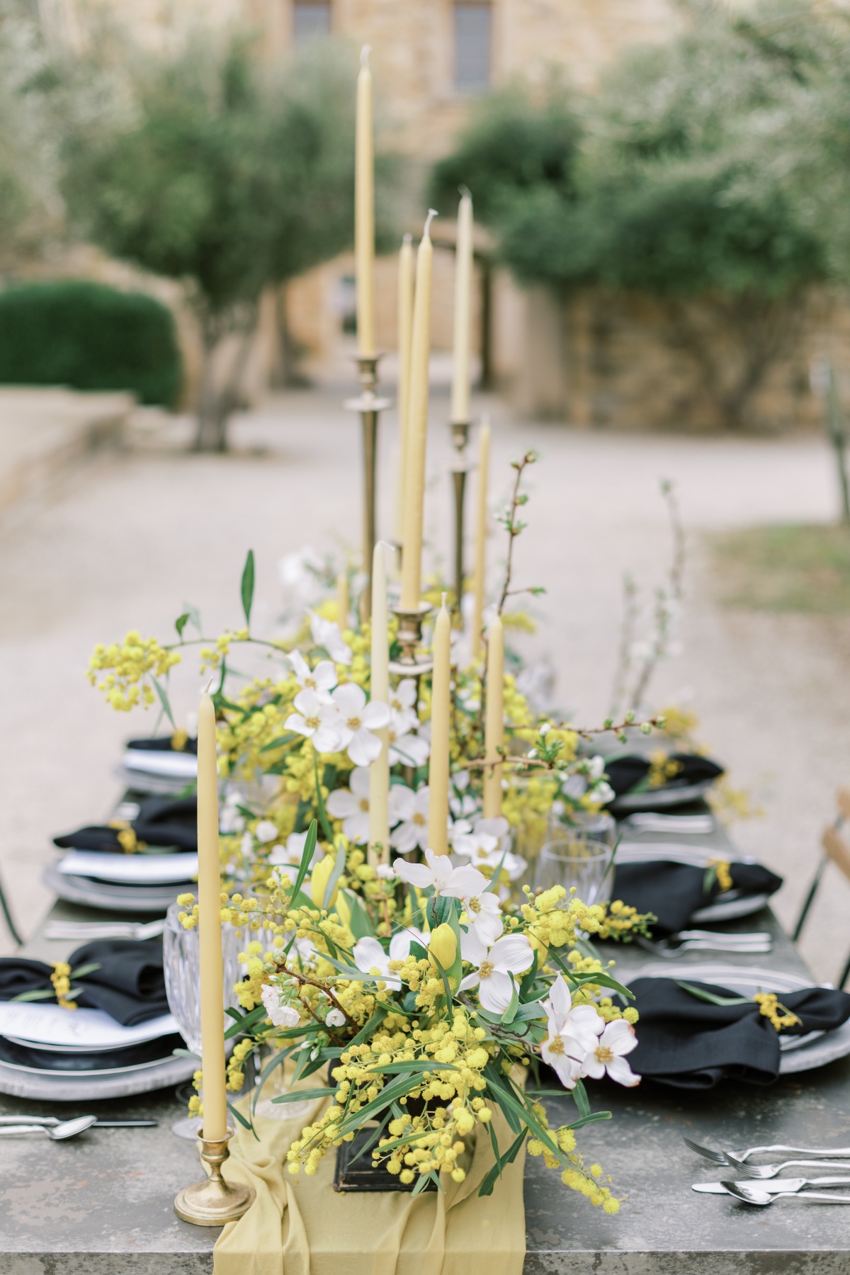 Elegant wedding table decor with candles and floral centerpiece