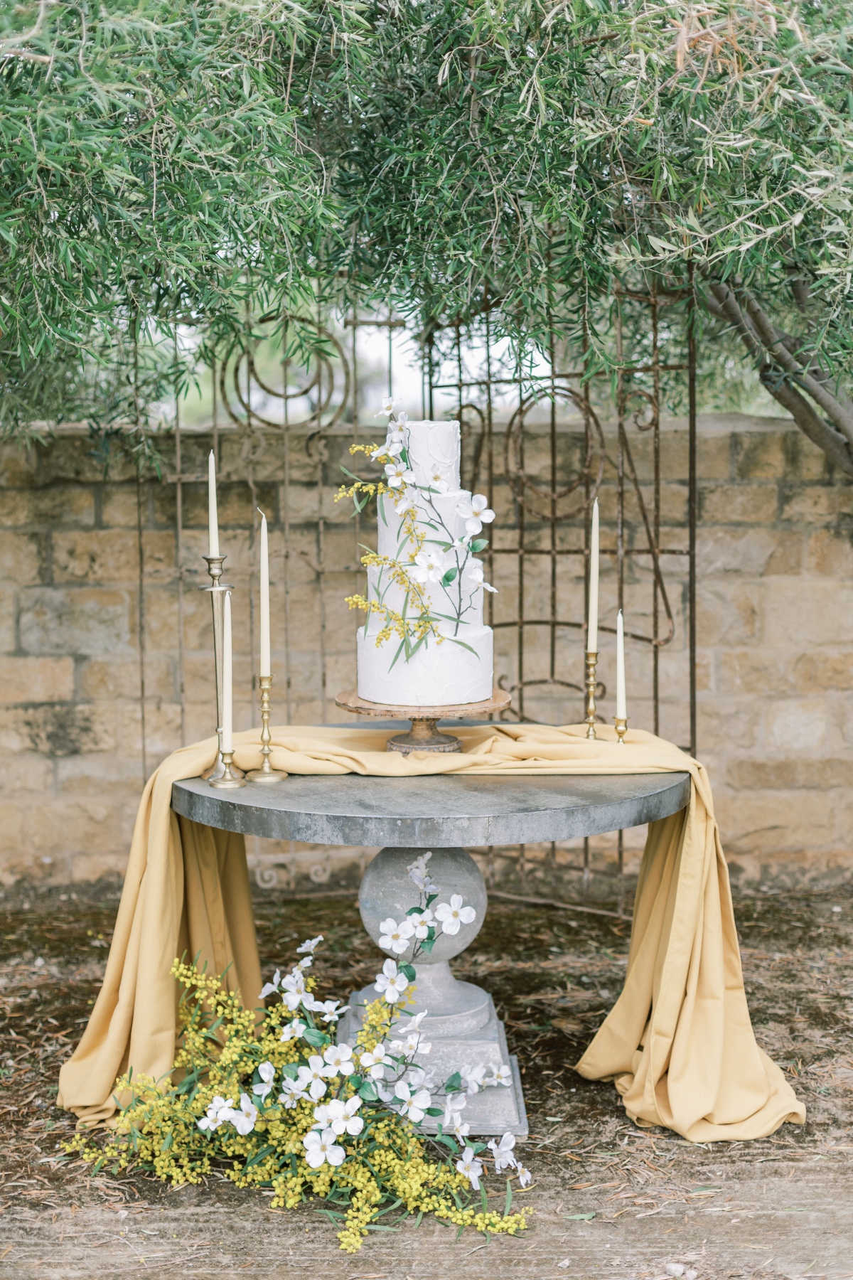 Elegant floral wedding cake display outdoor setting