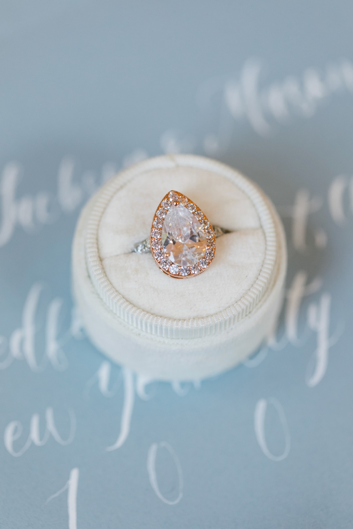 Elegant pear-shaped diamond engagement ring in a velvet ring box
