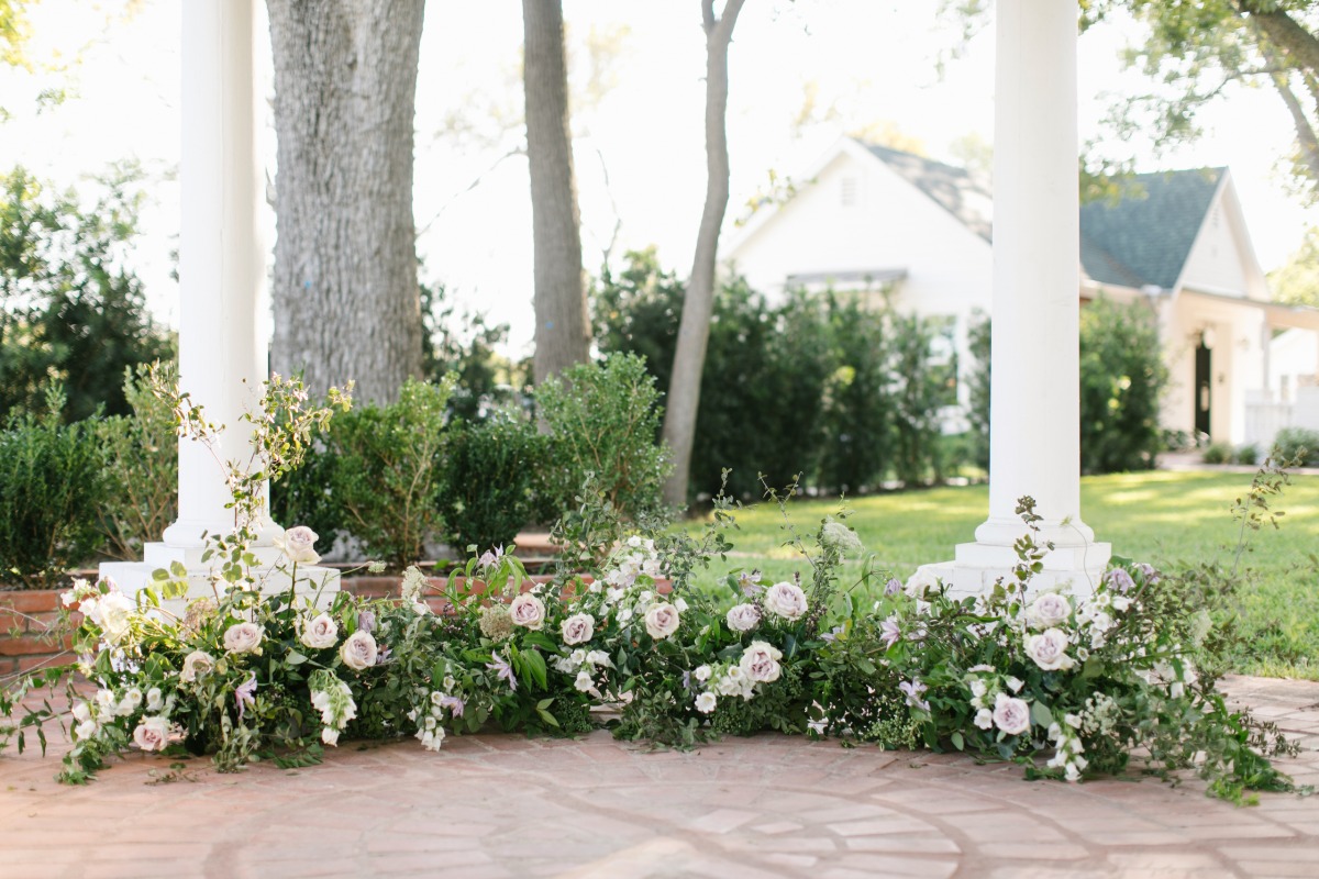 Elegant wedding flower arrangement at a beautiful outdoor ceremony
