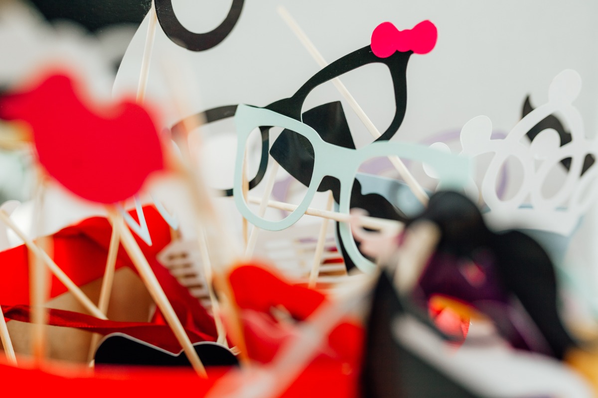 Photo booth props like glasses and lips on sticks