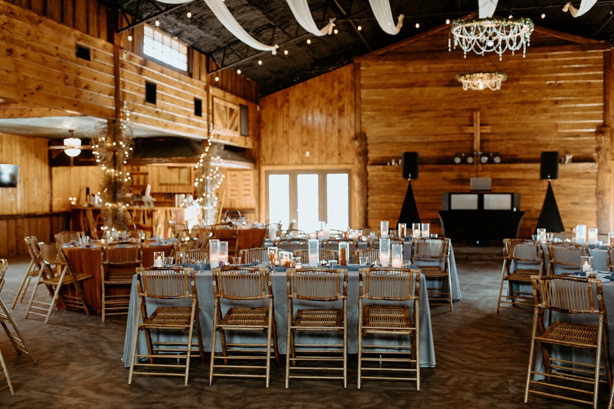 Rustic wedding reception venue with elegant table settings