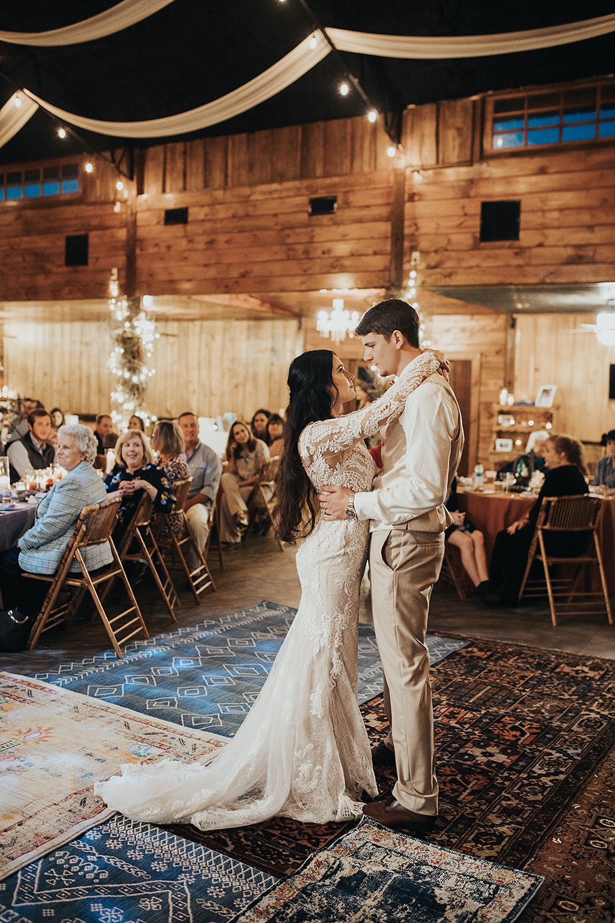 Bride and groom share a romantic dance at their wedding reception