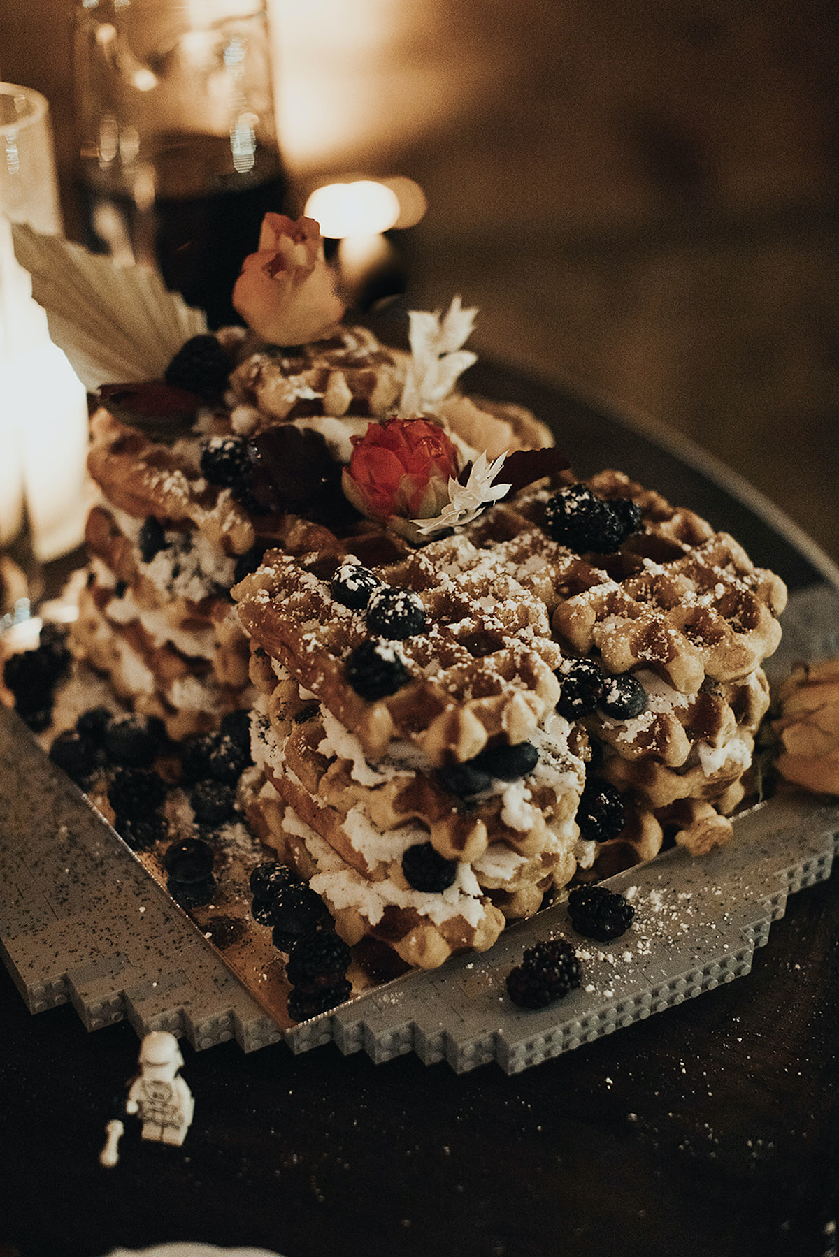 Stack of delicious waffles topped with berries and flowers