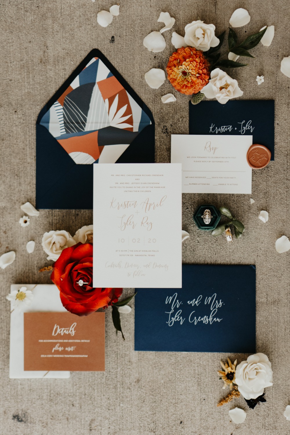 Elegant wedding invitation with floral details and rings