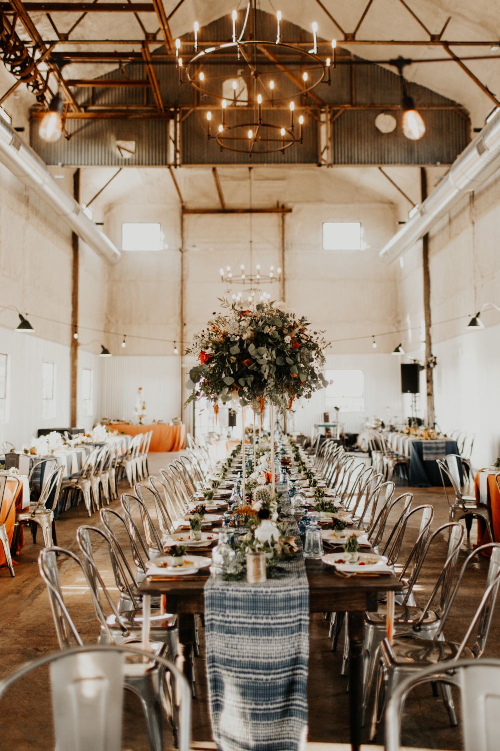 Elegant barn wedding reception with long table setup