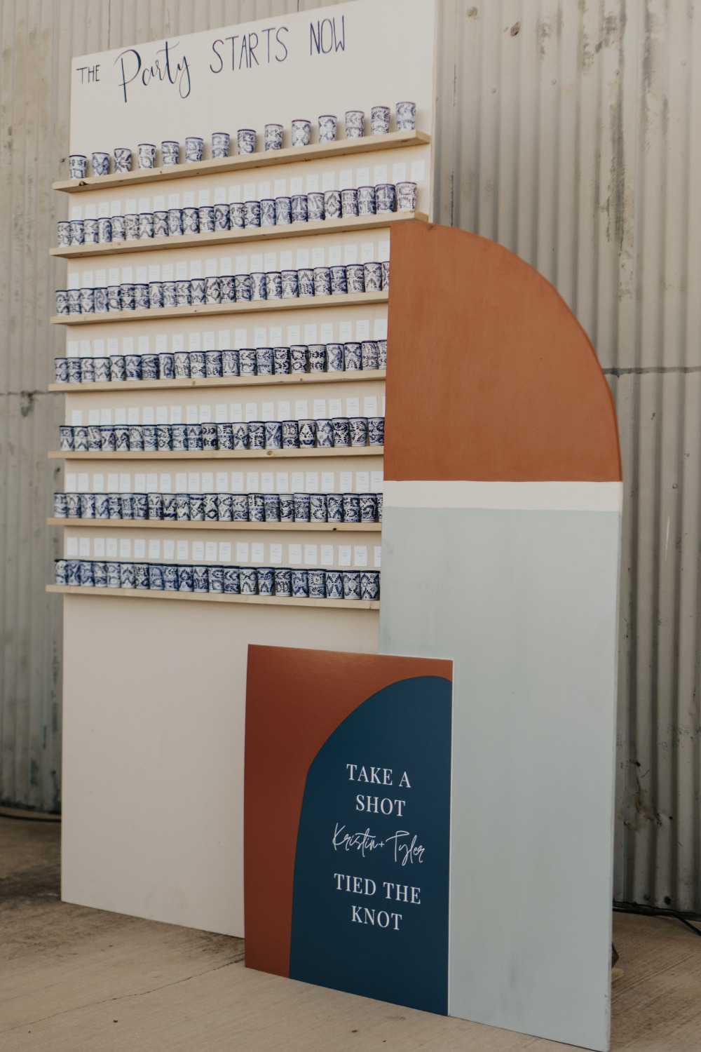 Wedding reception shot display with The Party Starts Now sign