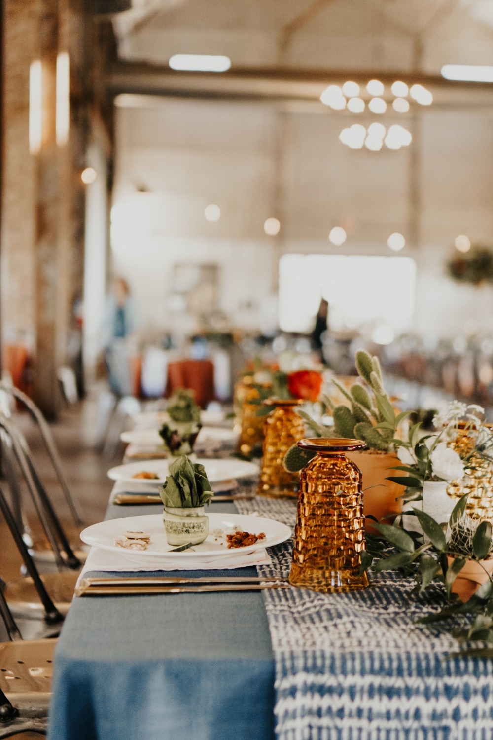 Elegant table setting with floral arrangements at a wedding reception