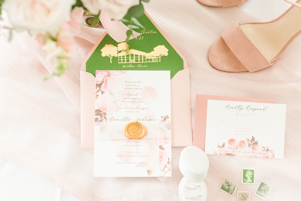 Elegant wedding invitation suite with floral details and venue card