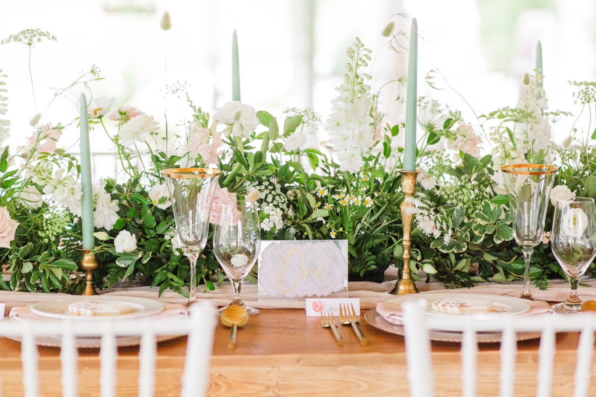 Elegant wedding table setting with floral centerpiece and candles