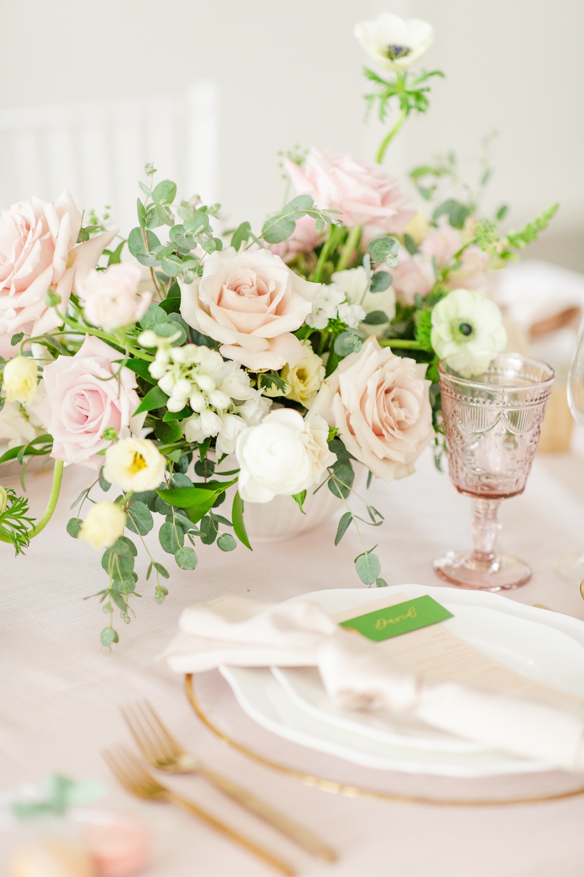 Elegant table setting with floral centerpiece and place setting