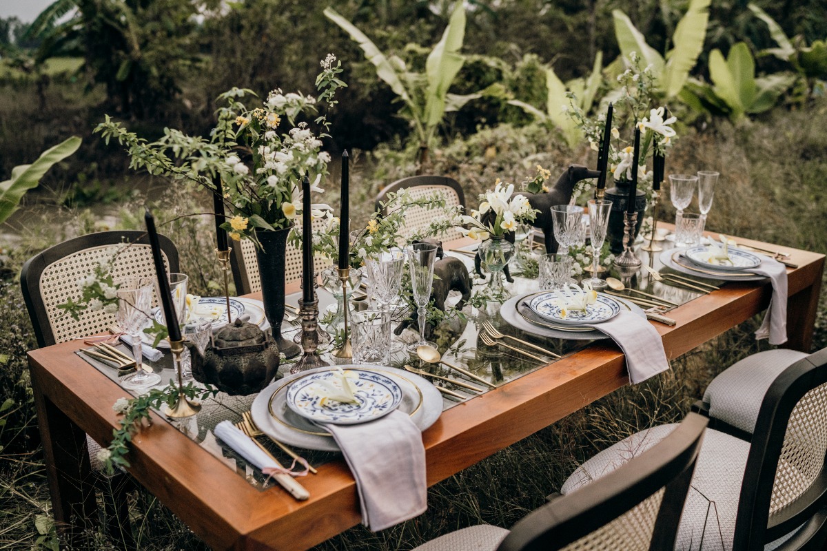 Elegant outdoor wedding table setting with floral decor