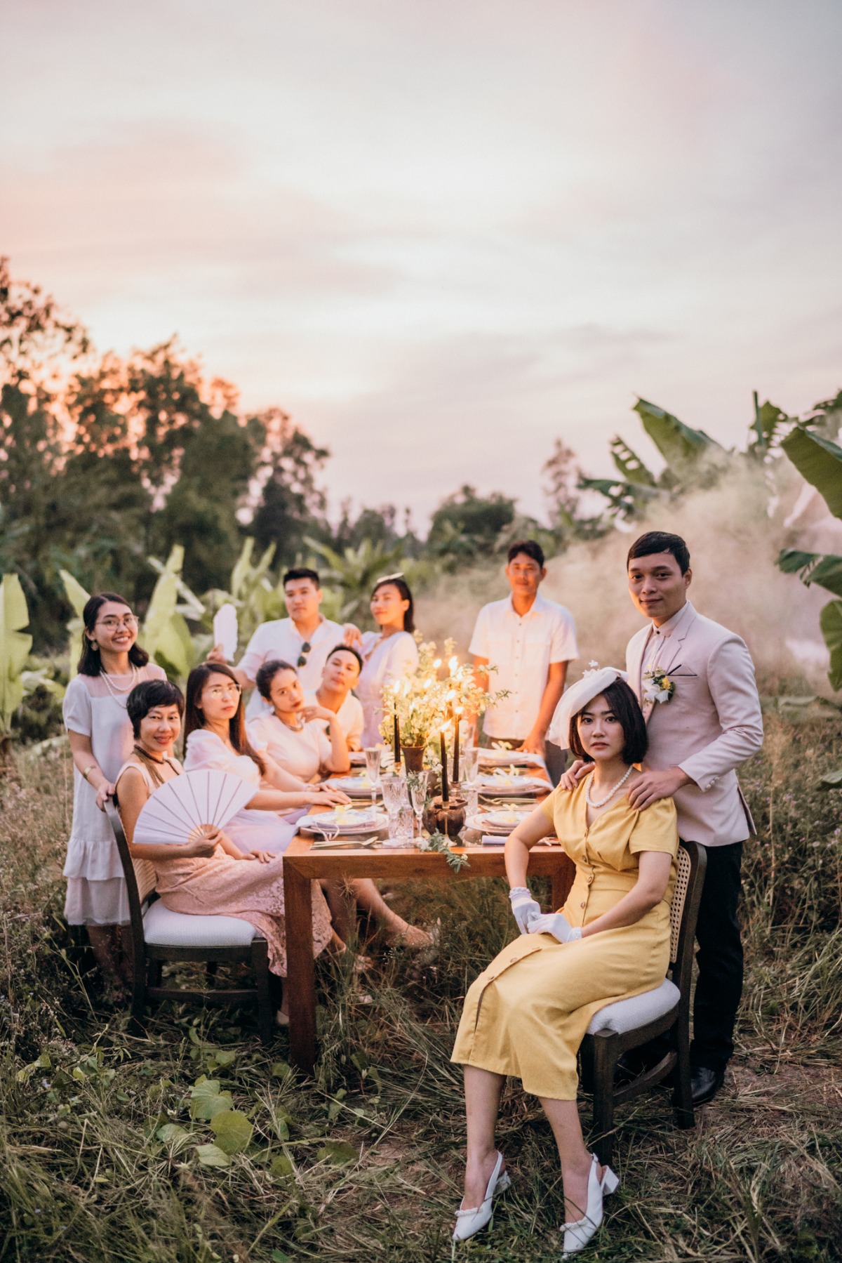 Vintage themed outdoor wedding reception with dressed guests