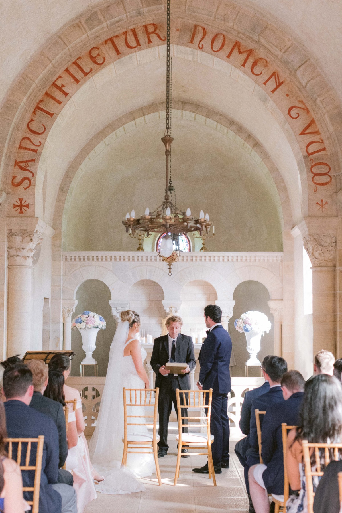 Wedding ceremony in a beautiful ancient church setting, guests present