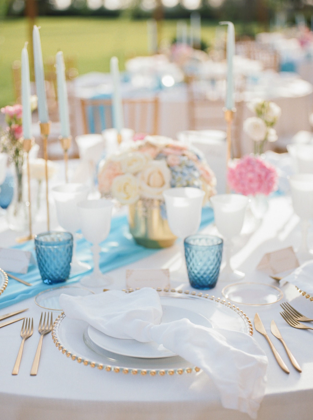 Elegant wedding table setting with floral centerpiece and candles
