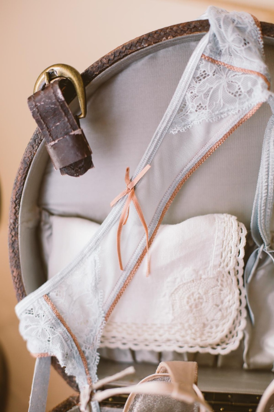 Delicate lace lingerie in vintage suitcase detail shot
