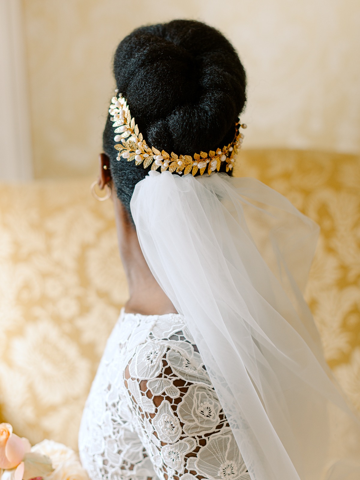Bride wearing a golden headpiece and veil, perfect wedding style