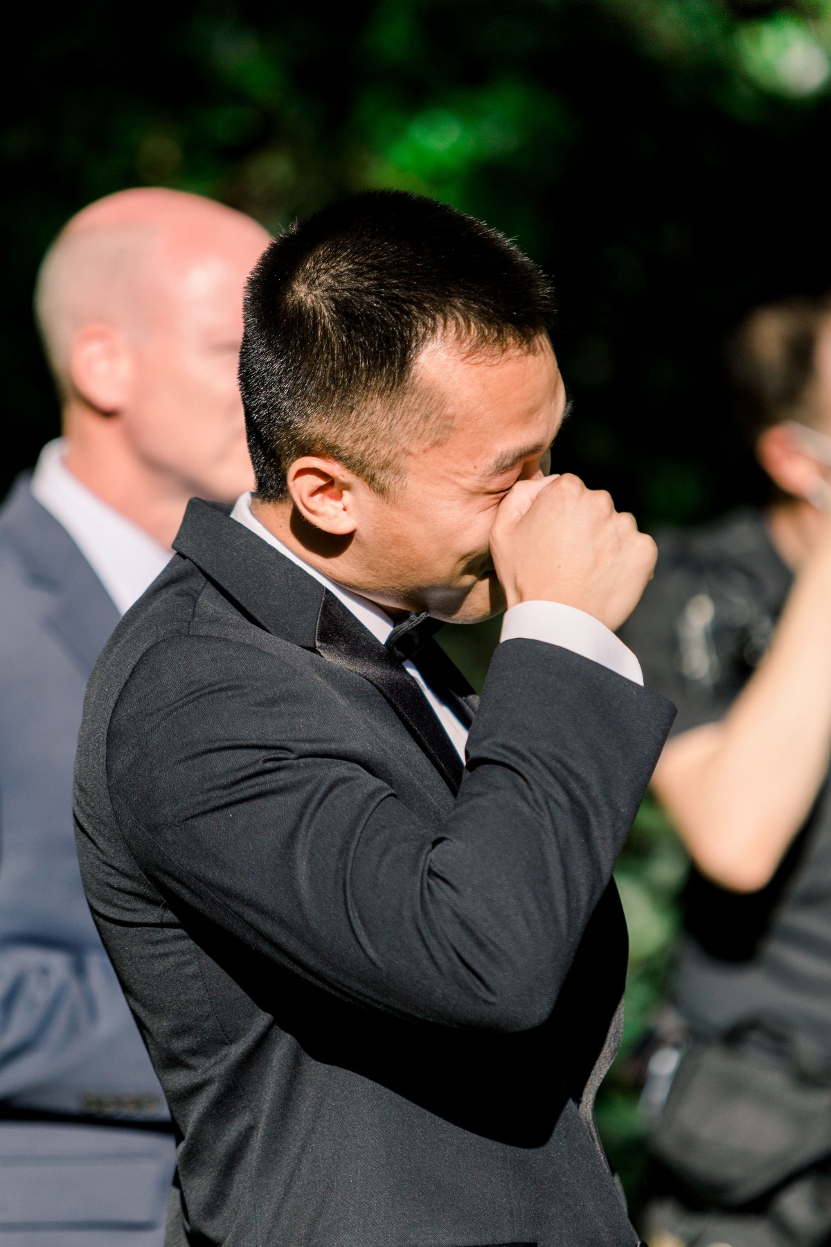Groom wipes away tears during emotional wedding moment