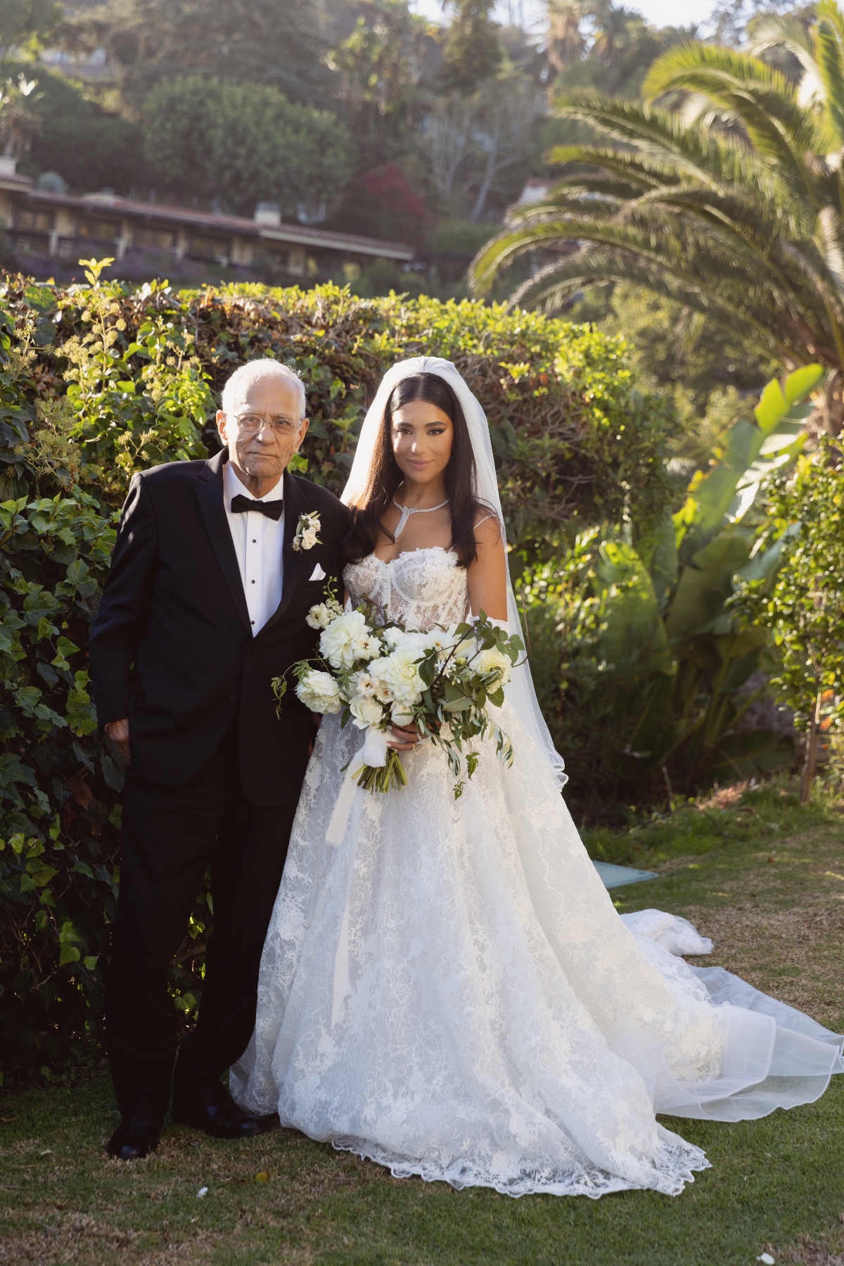 Bride with her father on her wedding day, outdoor shot
