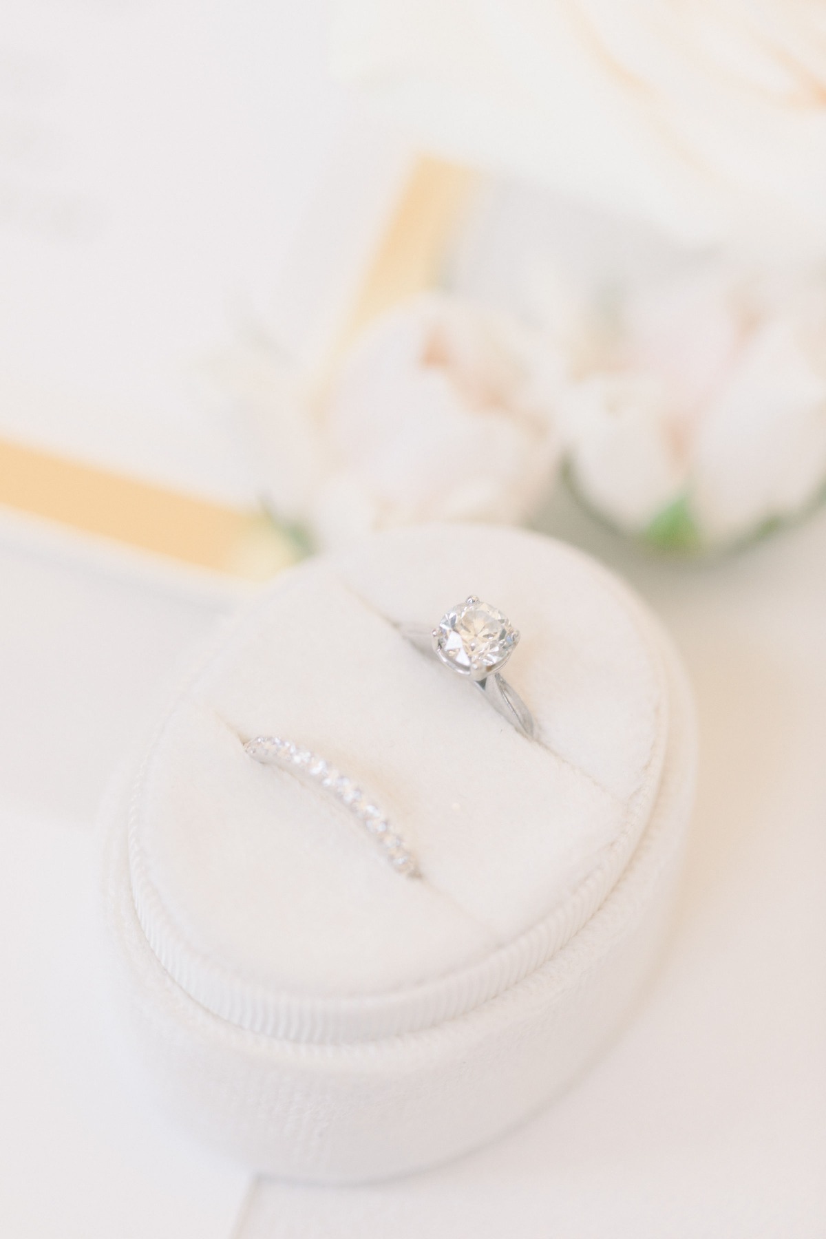 Elegant diamond engagement ring and band in white case
