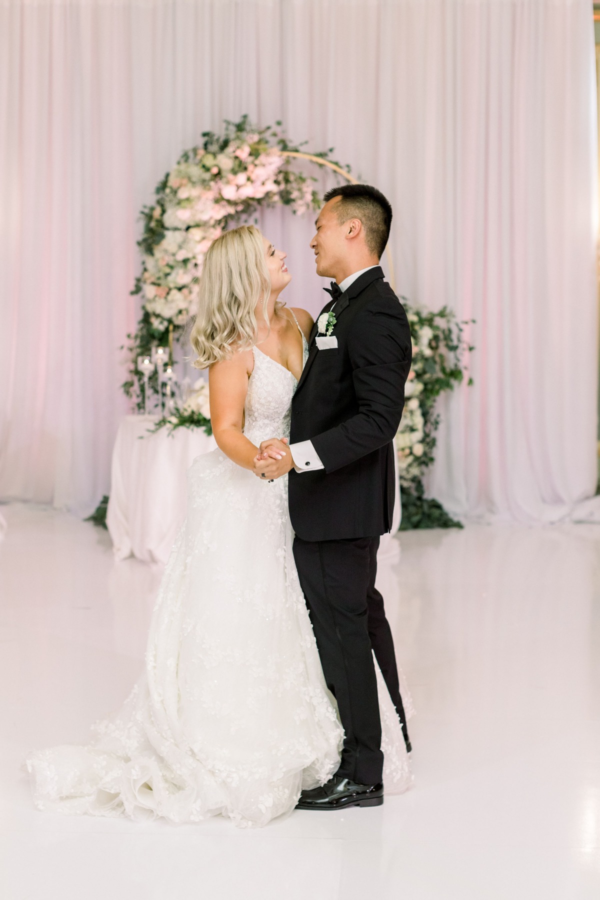 Bride and groom share first dance at wedding reception