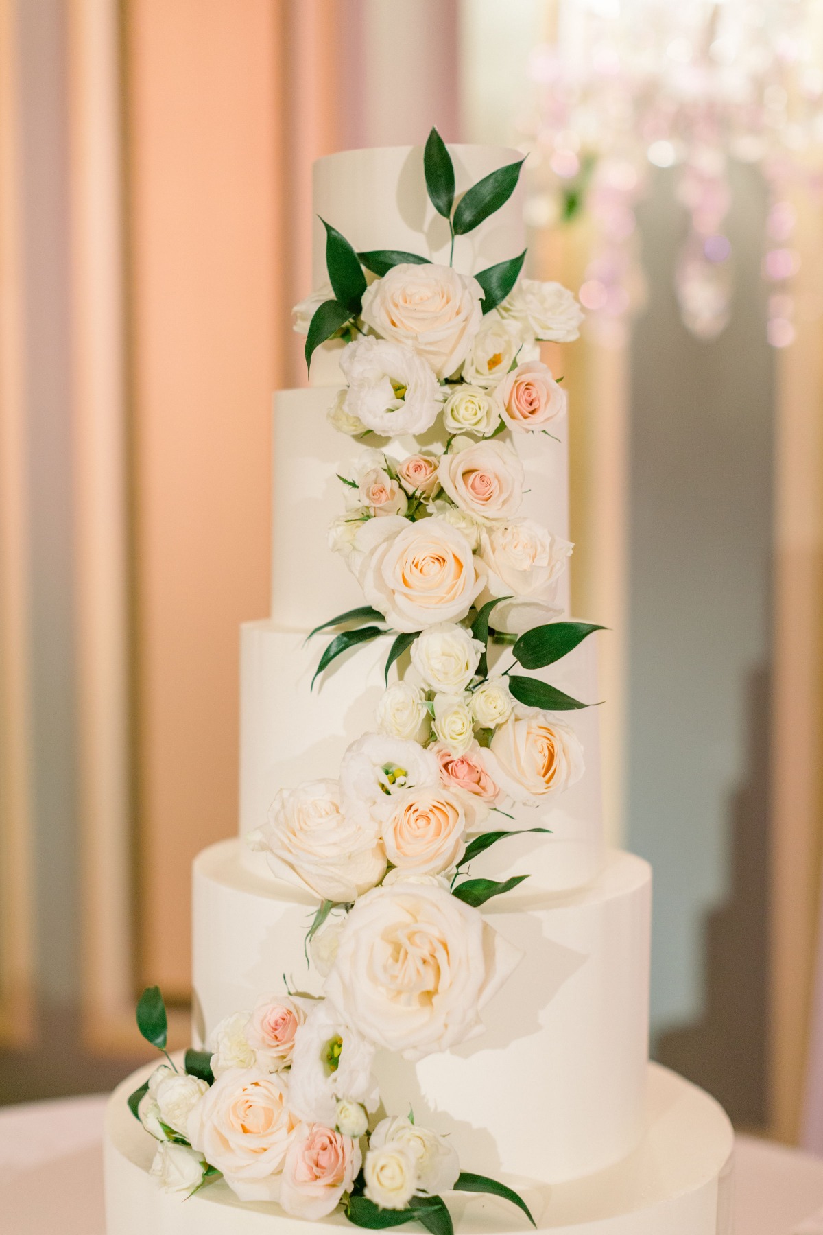 Elegant four tier wedding cake with floral decorations