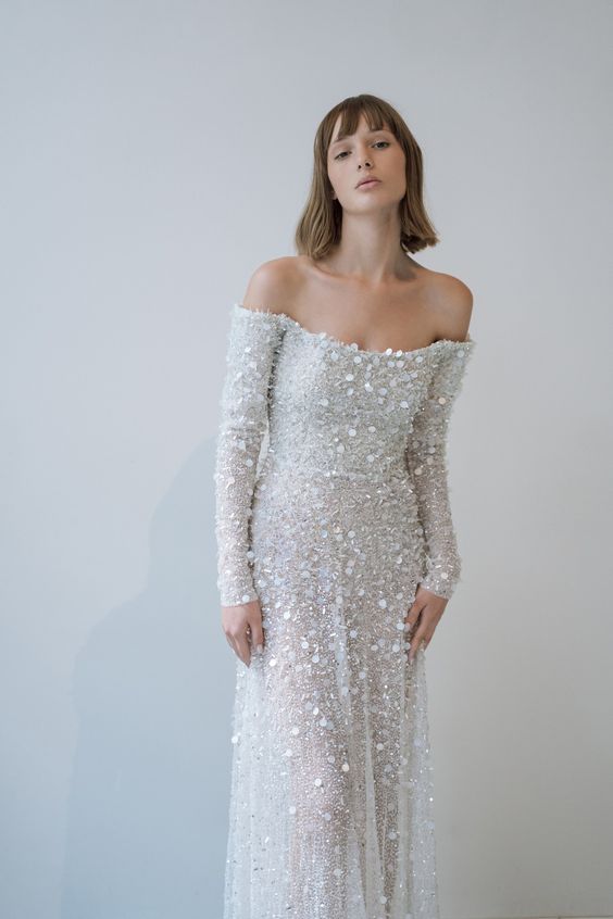 Elegant woman in a beaded off shoulder wedding gown