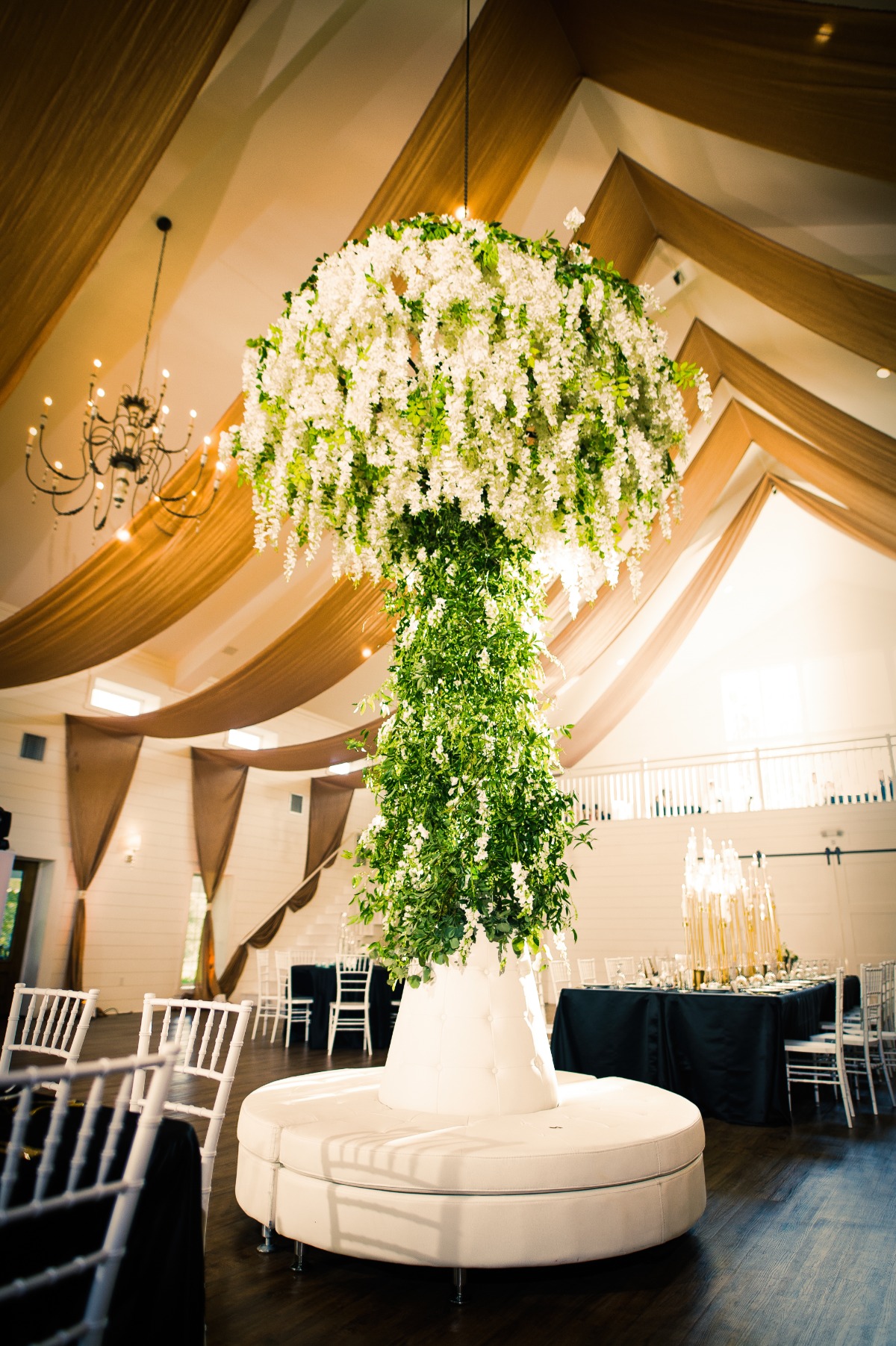 A Grand Reception With A Giant Floral Chandelier That Almost Touched The Floor