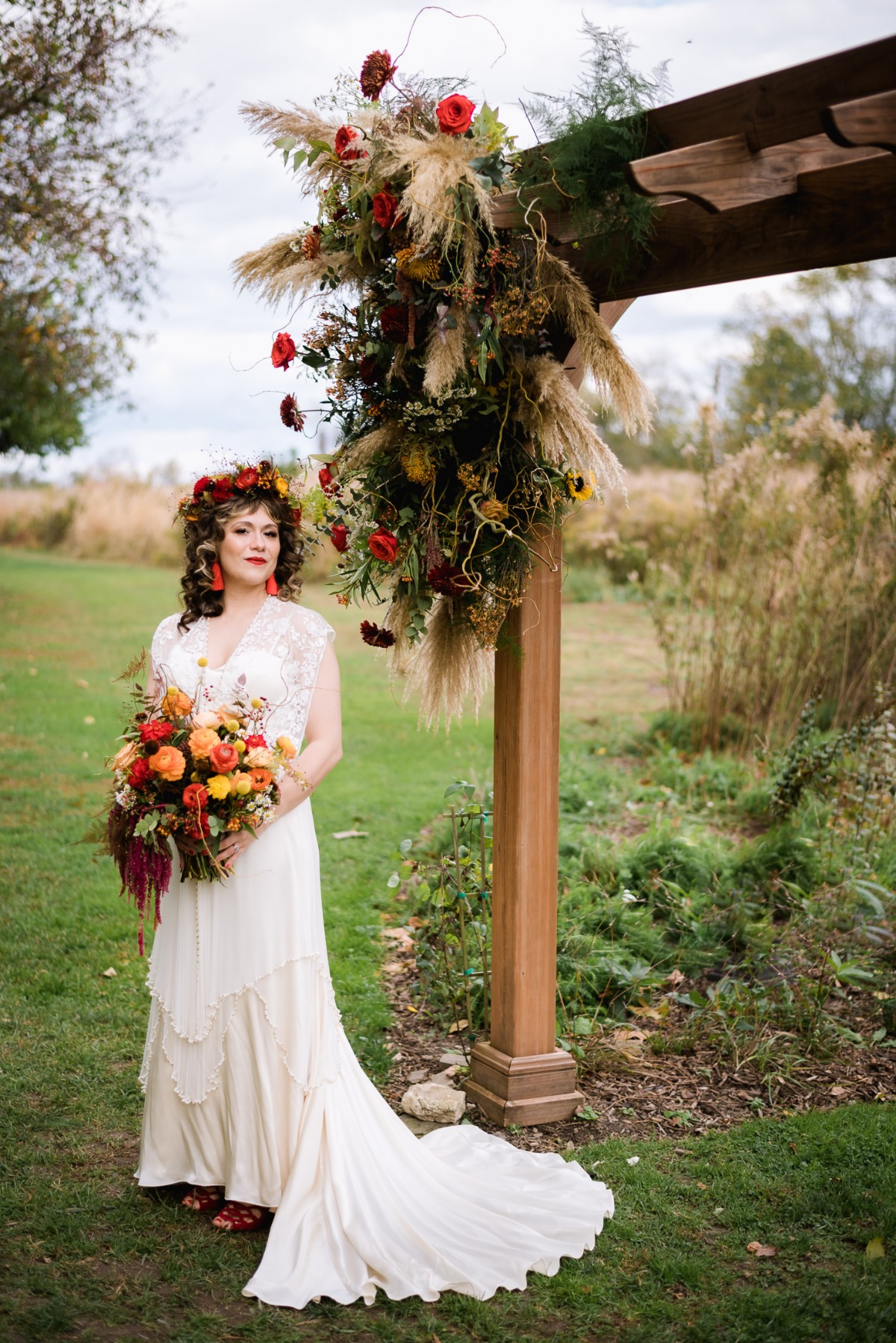 Bohemian bride in a field with colorful flowers wedding theme