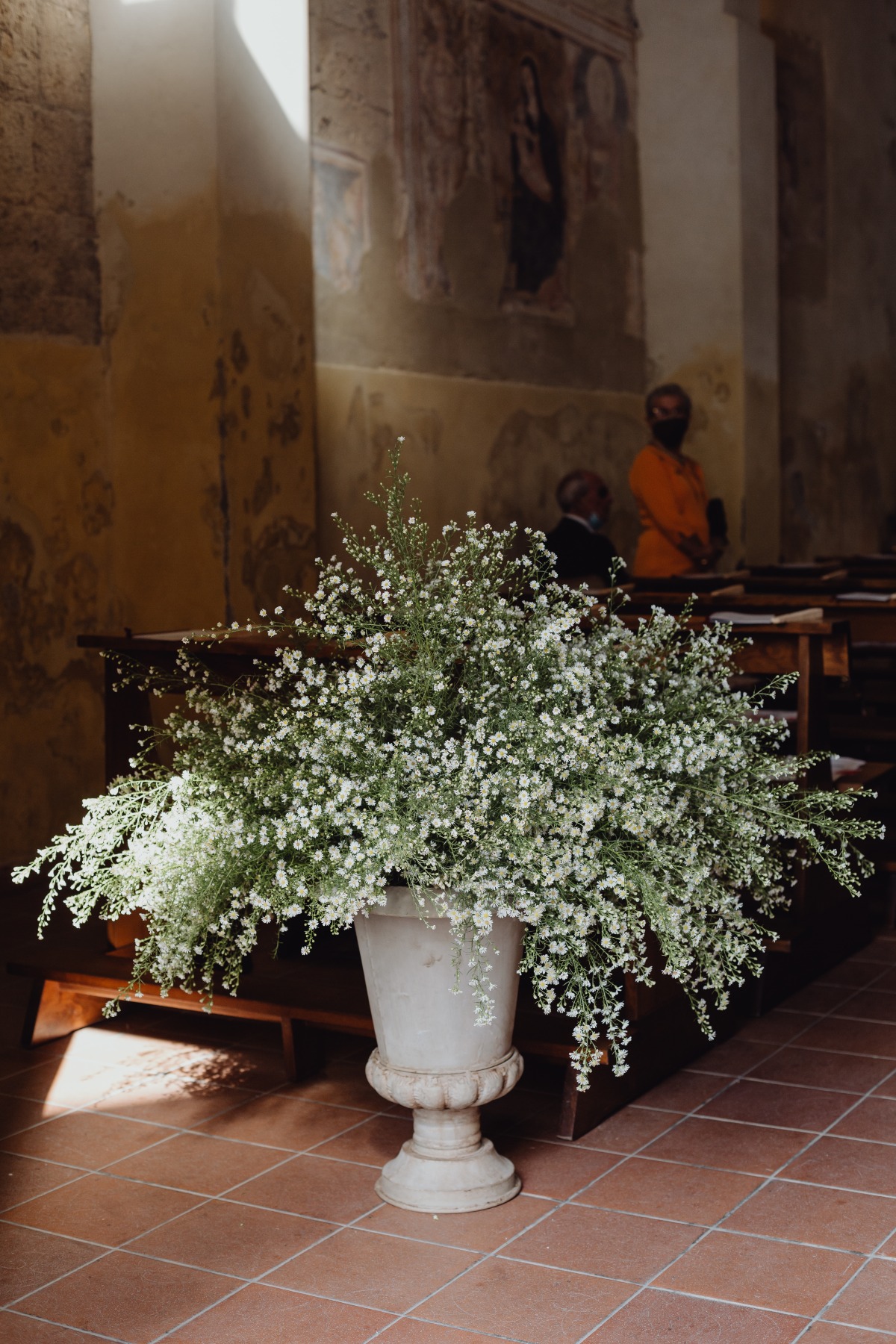 A beautiful flower arrangement in a church adds a touch of elegance