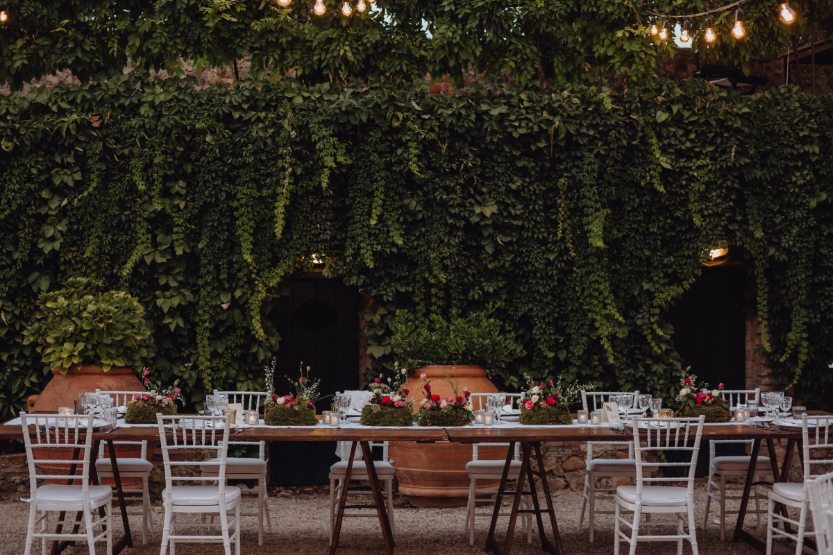 Elegant outdoor wedding reception table with floral decor