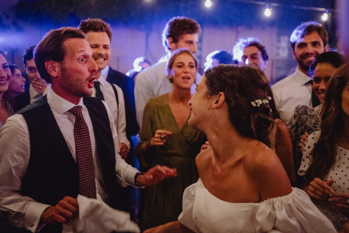 Wedding guests dancing with emotion at a lively celebration
