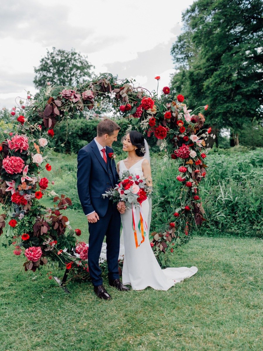 Beautiful Garden Ceremony And A Flower Arch With Blooms As Big As Your Head