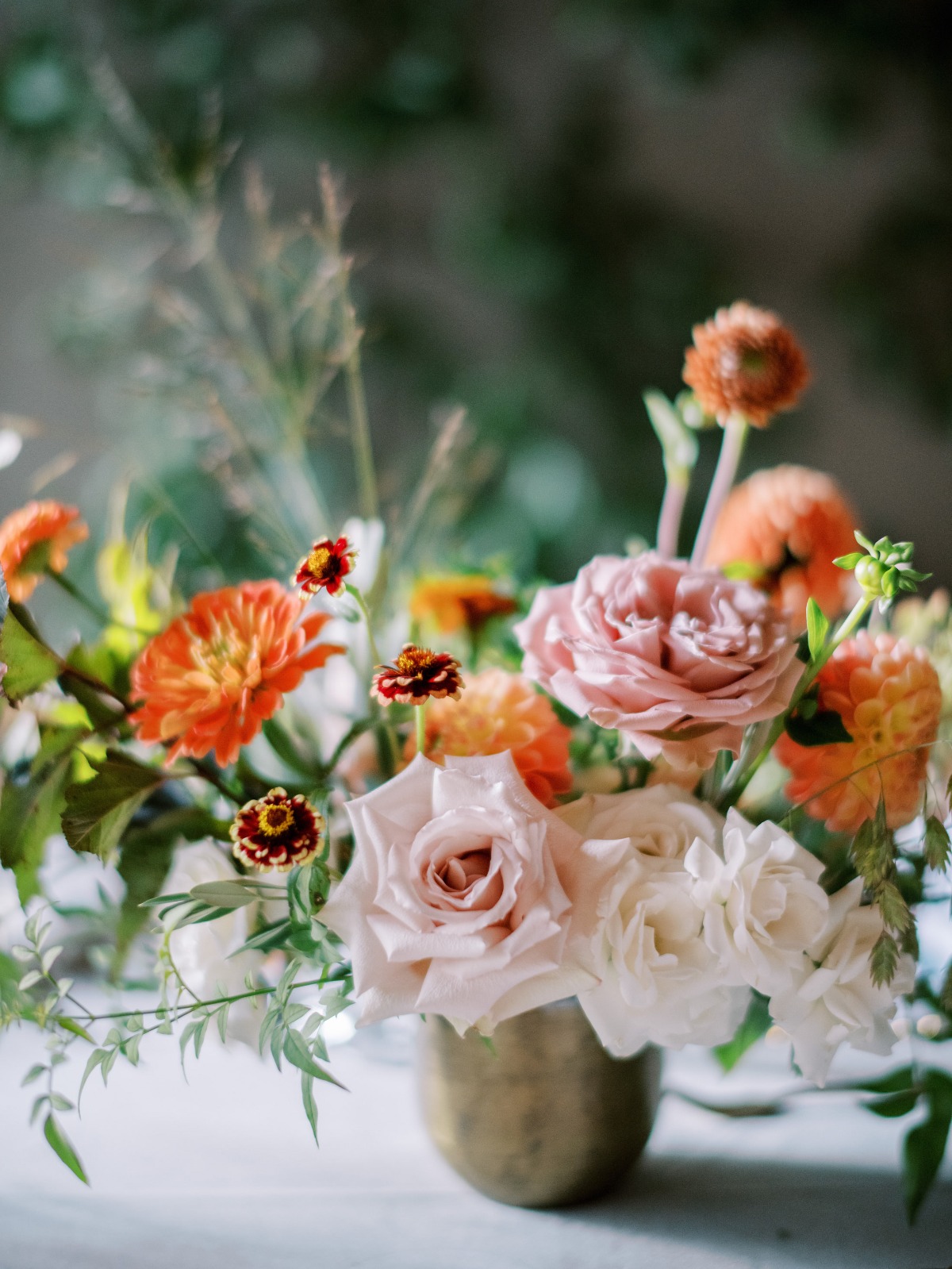Elegant floral arrangement with pink roses and dahlias