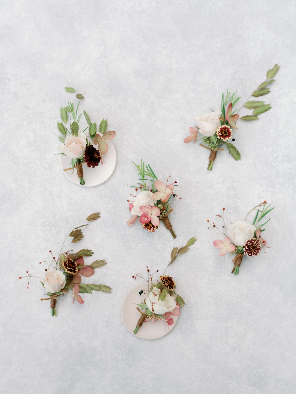 Elegant floral boutonnieres for a rustic wedding theme