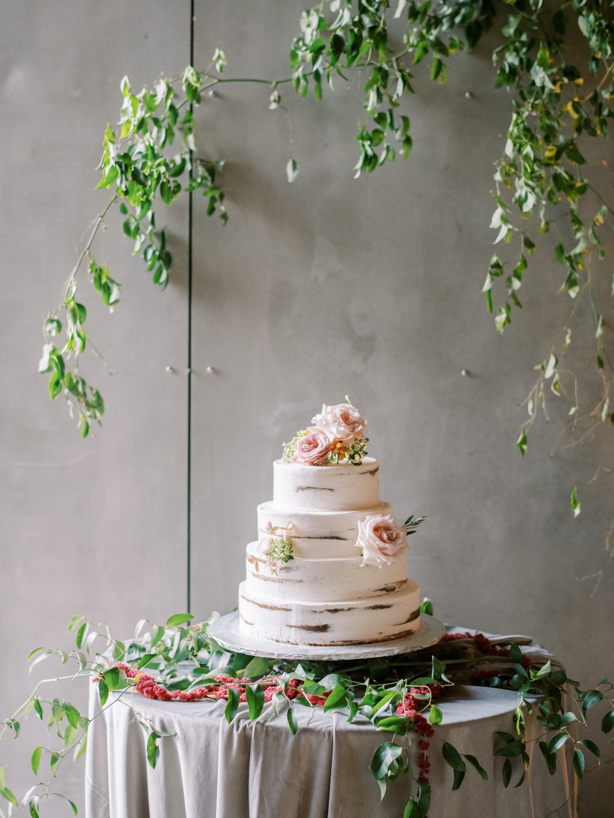 Elegant four tier wedding cake with floral decorations