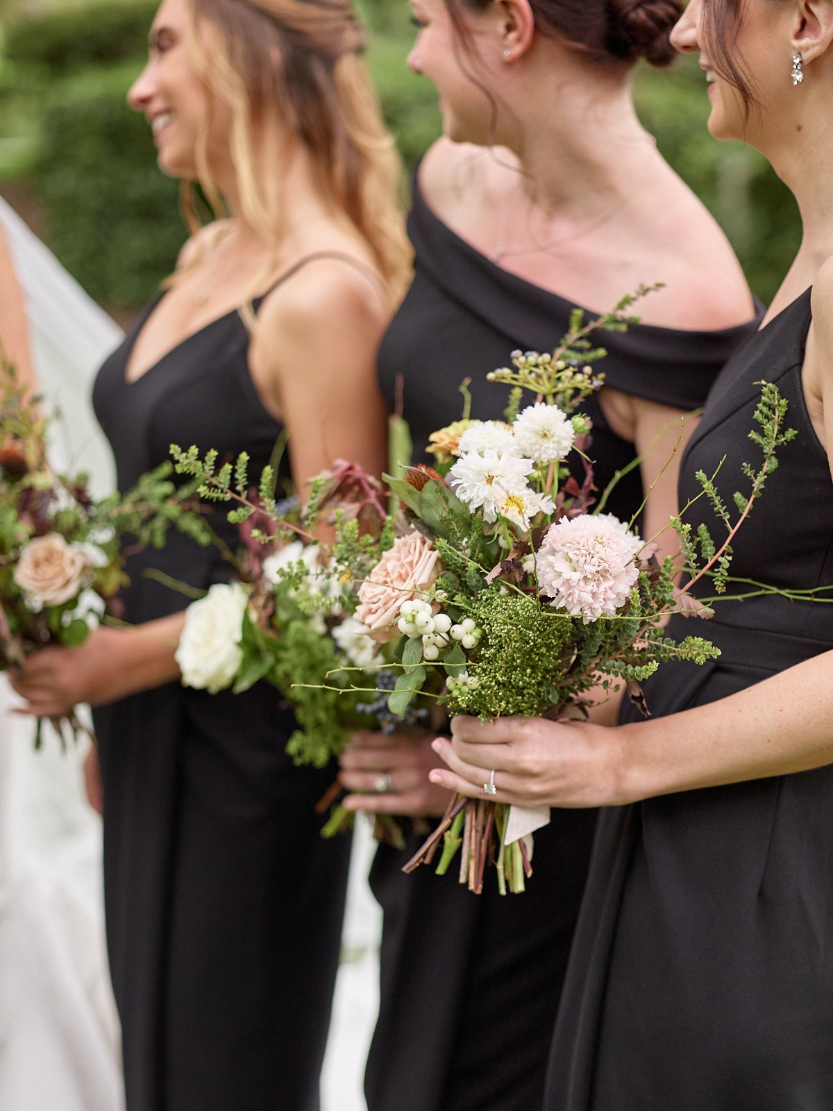 Close-up of bridesmaids holding bouquets