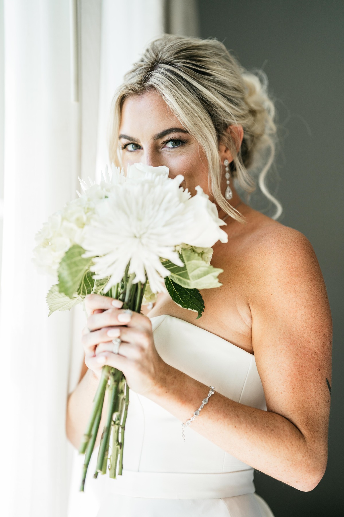 Bride holding up bouquet