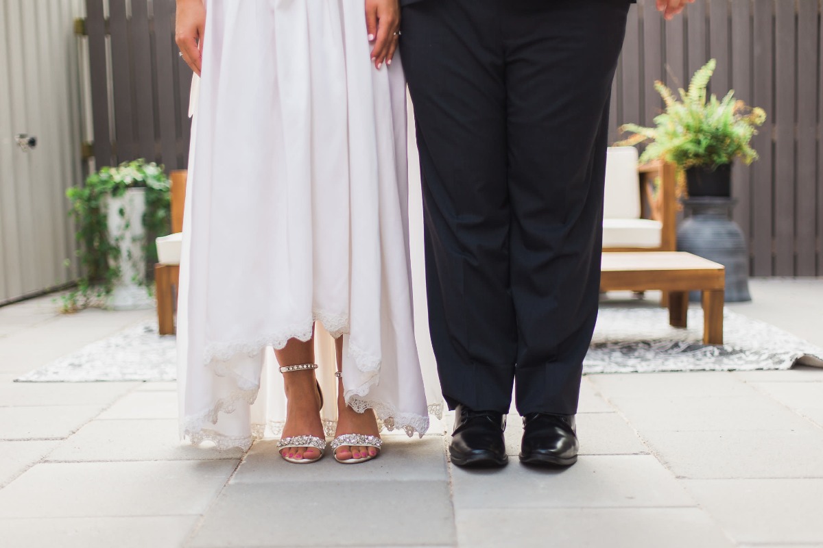 bride wears vintage wedding dress to wedding and reception