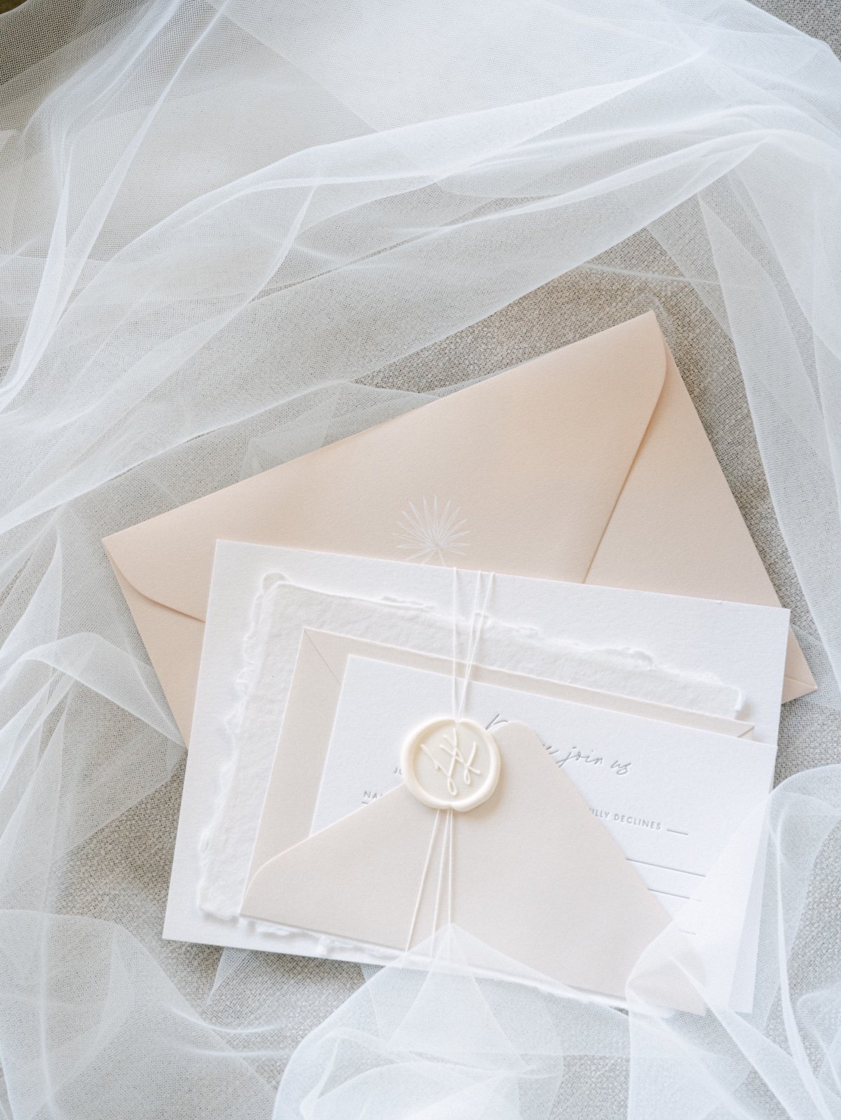 Aerial photo of stationery surrounded by tulle