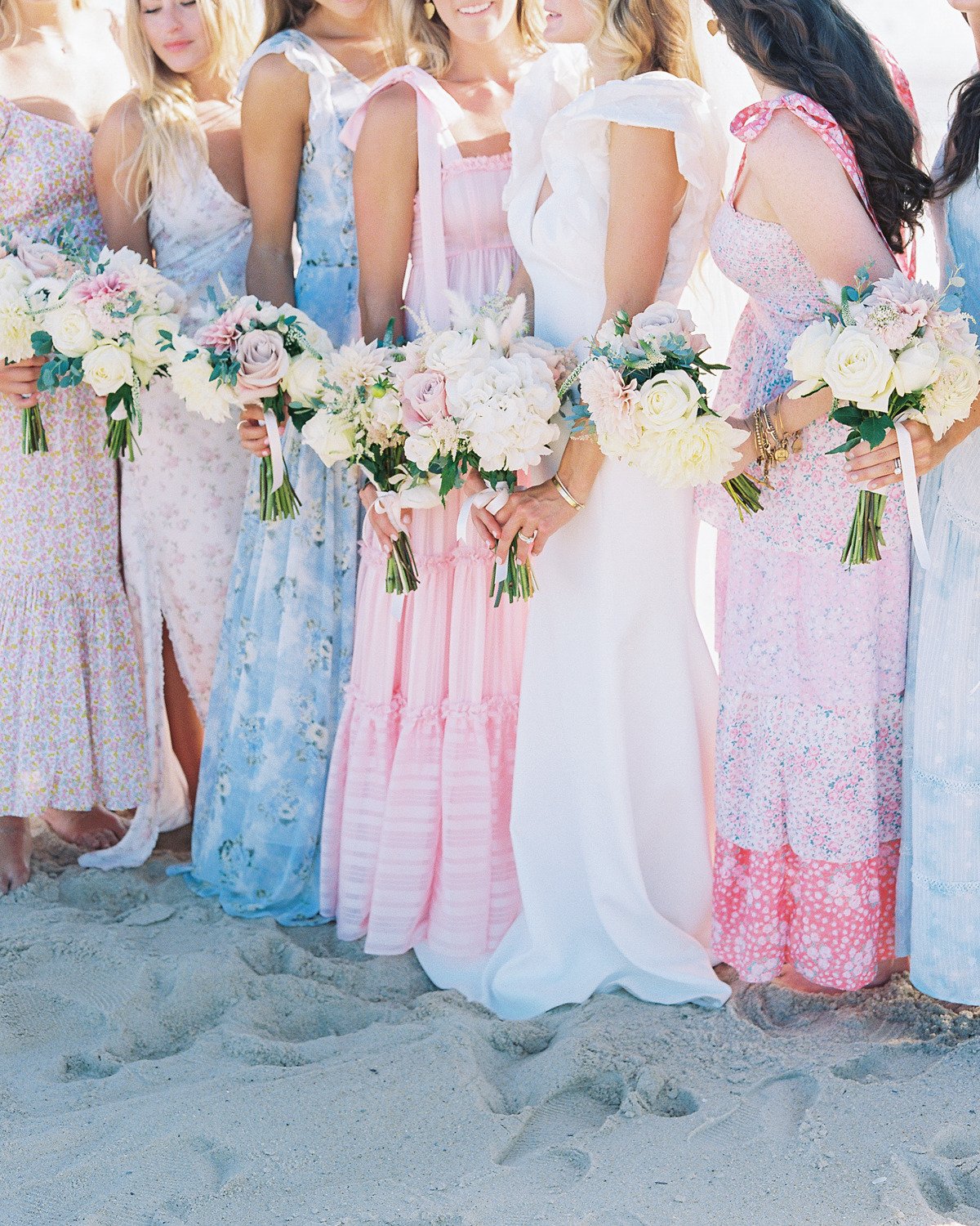 Bridesmaids loveshackfancy dresses and bouquets